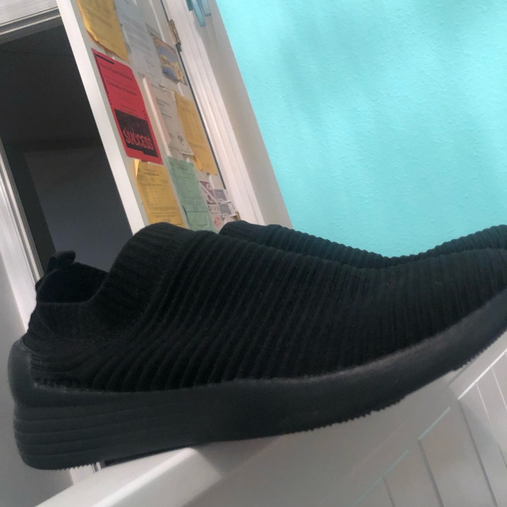 All black cloth sneakers